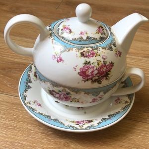 Tiny floral teapot with cup and saucer